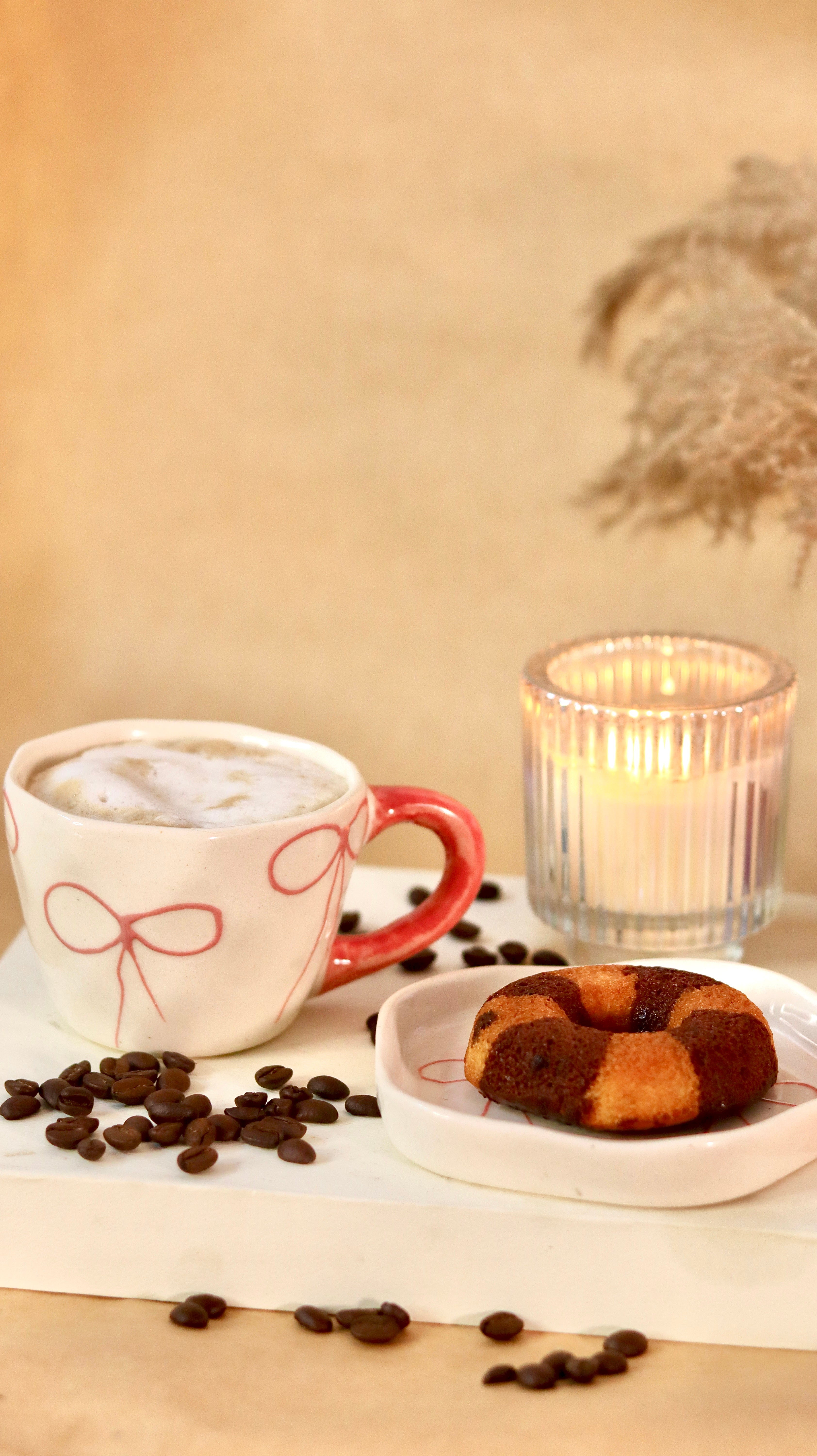 À La Bow ceramic cup and saucer set with delicate bow detail and soft blush finish by KLAEORA