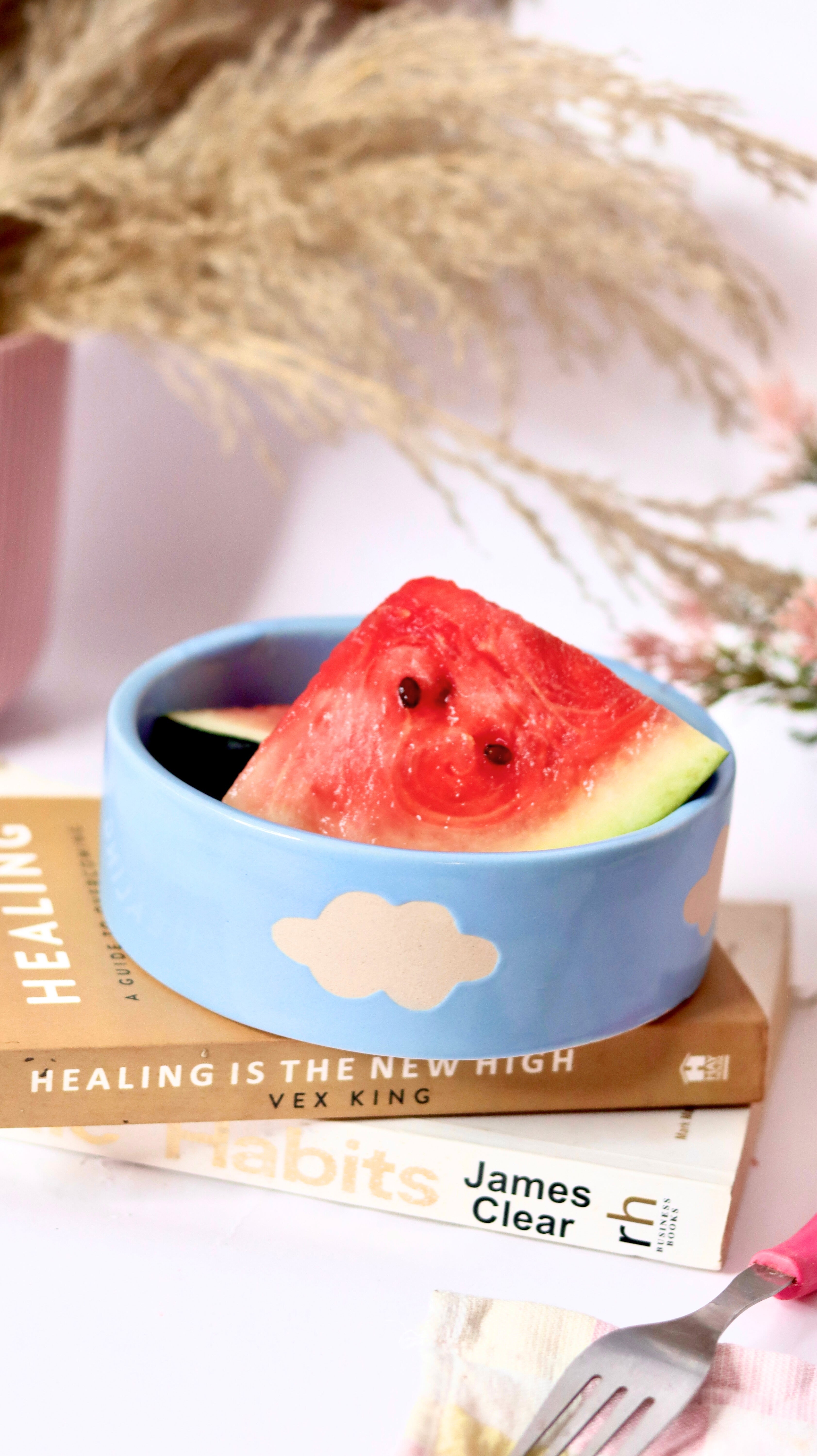 Cloud Munch Bowl by KLAEORA – hand-painted blue ceramic snack bowl with white cloud design in pastel hues