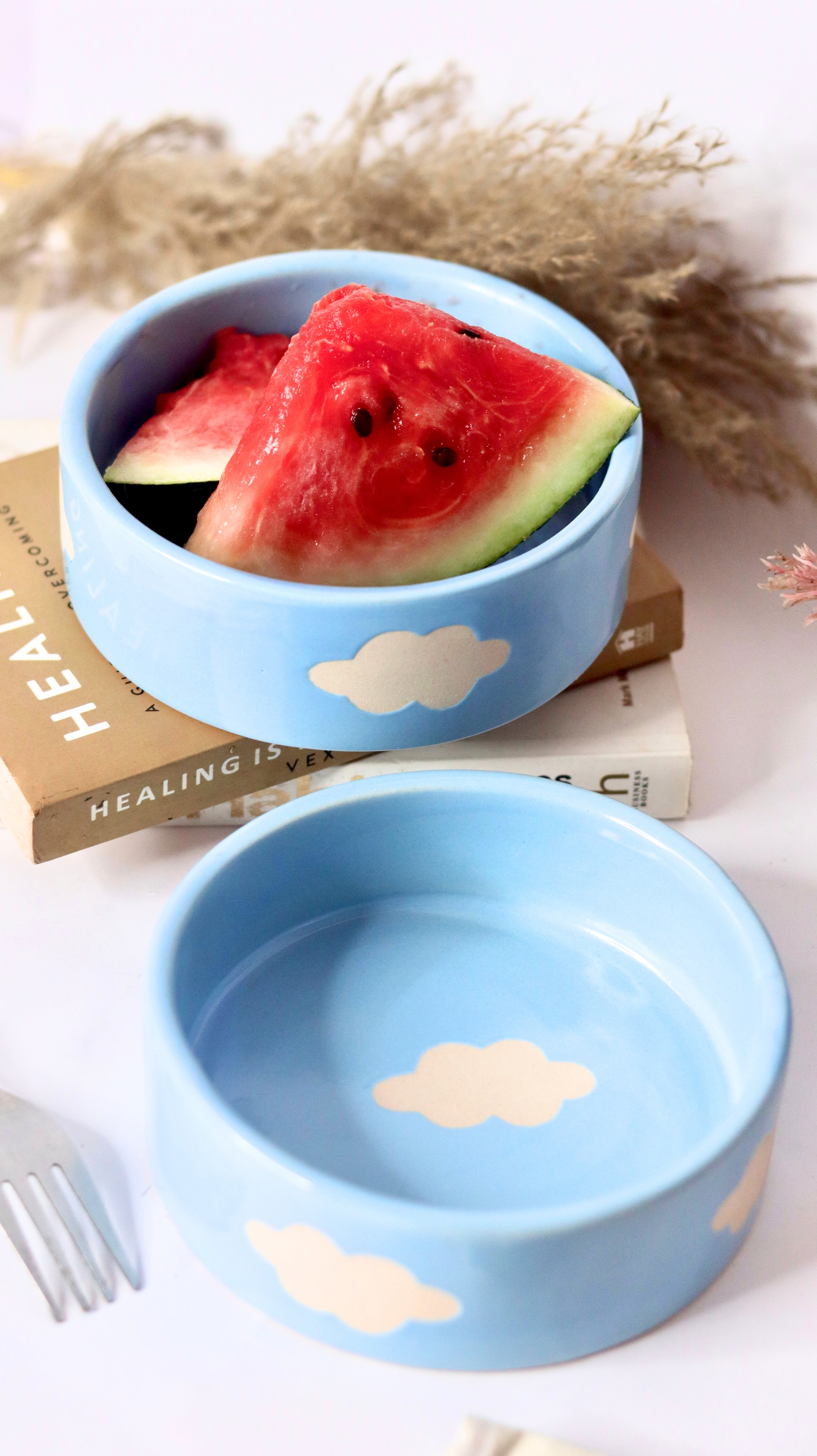 Cloud Munch Bowl by KLAEORA – hand-painted blue ceramic snack bowl with white cloud design in pastel hues