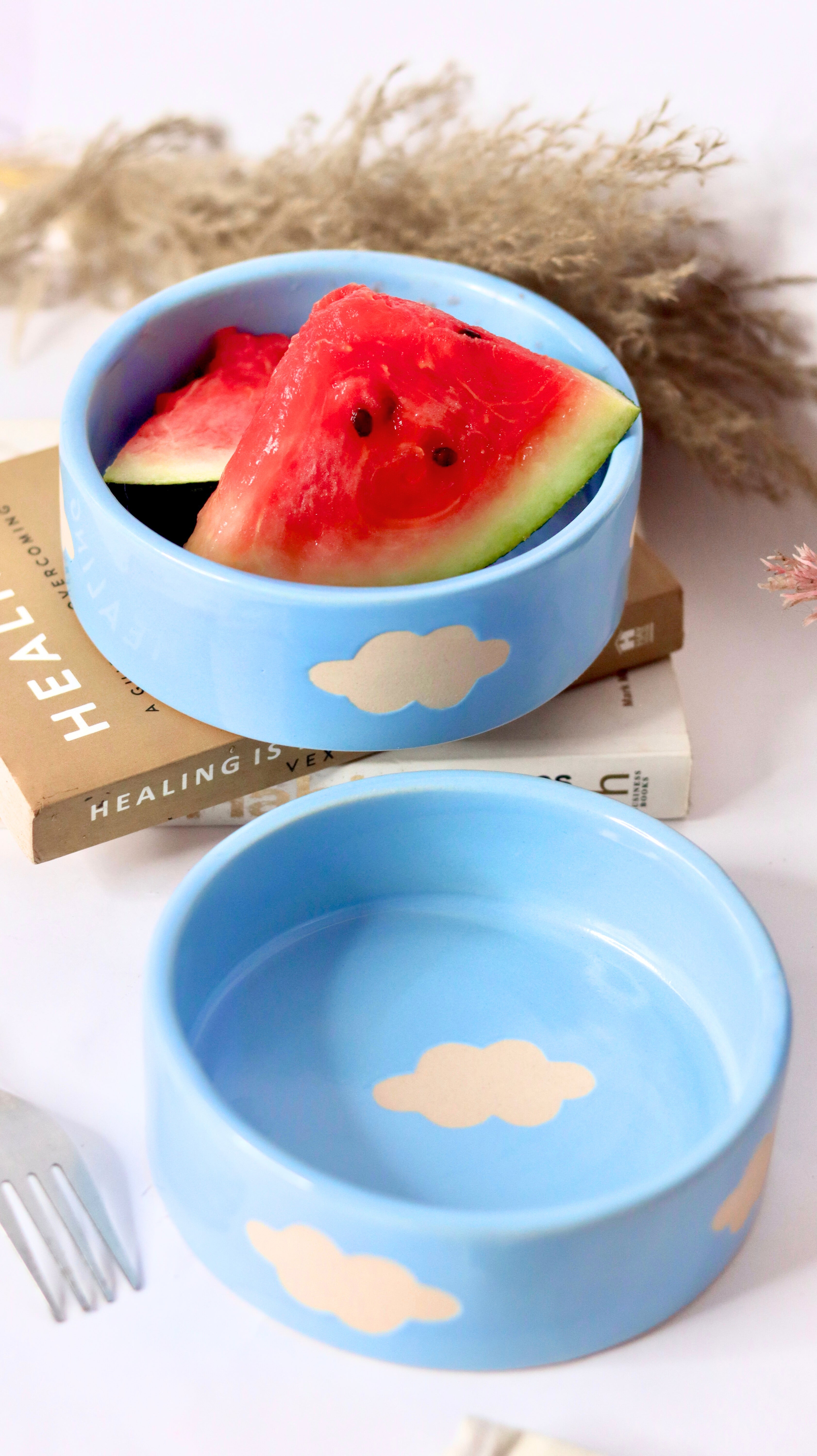 Cloud Munch Bowl by KLAEORA – hand-painted blue ceramic snack bowl with white cloud design in pastel hues