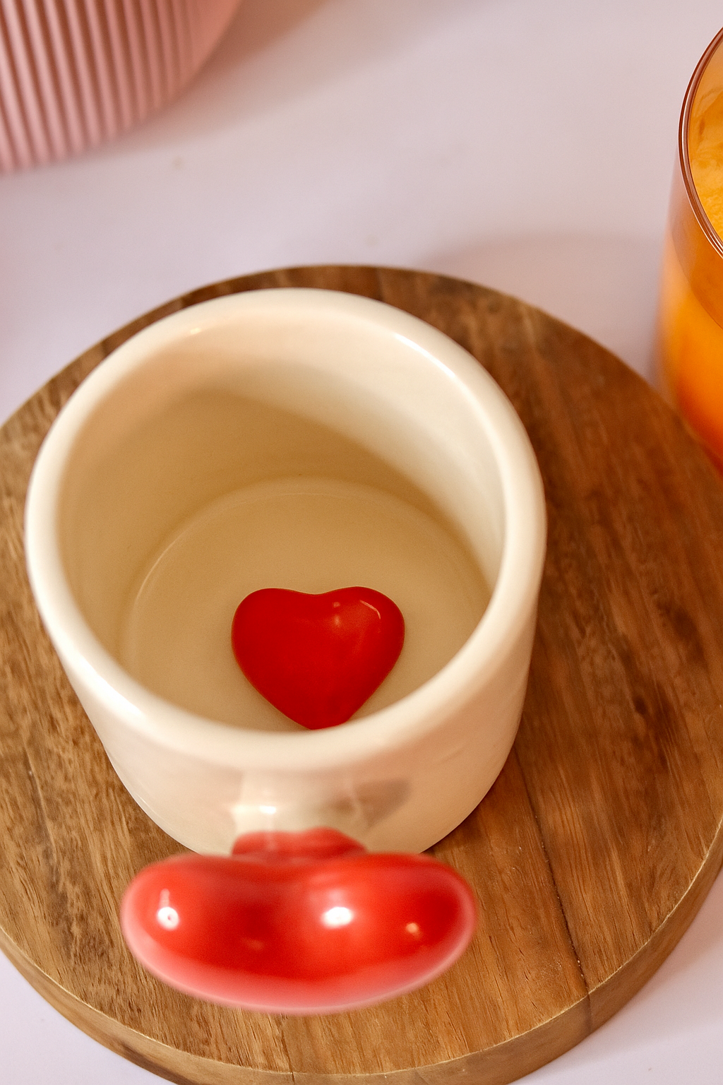 Lovella ceramic mug with cream base and raised glossy red heart & pink heart detail by KLAEORA