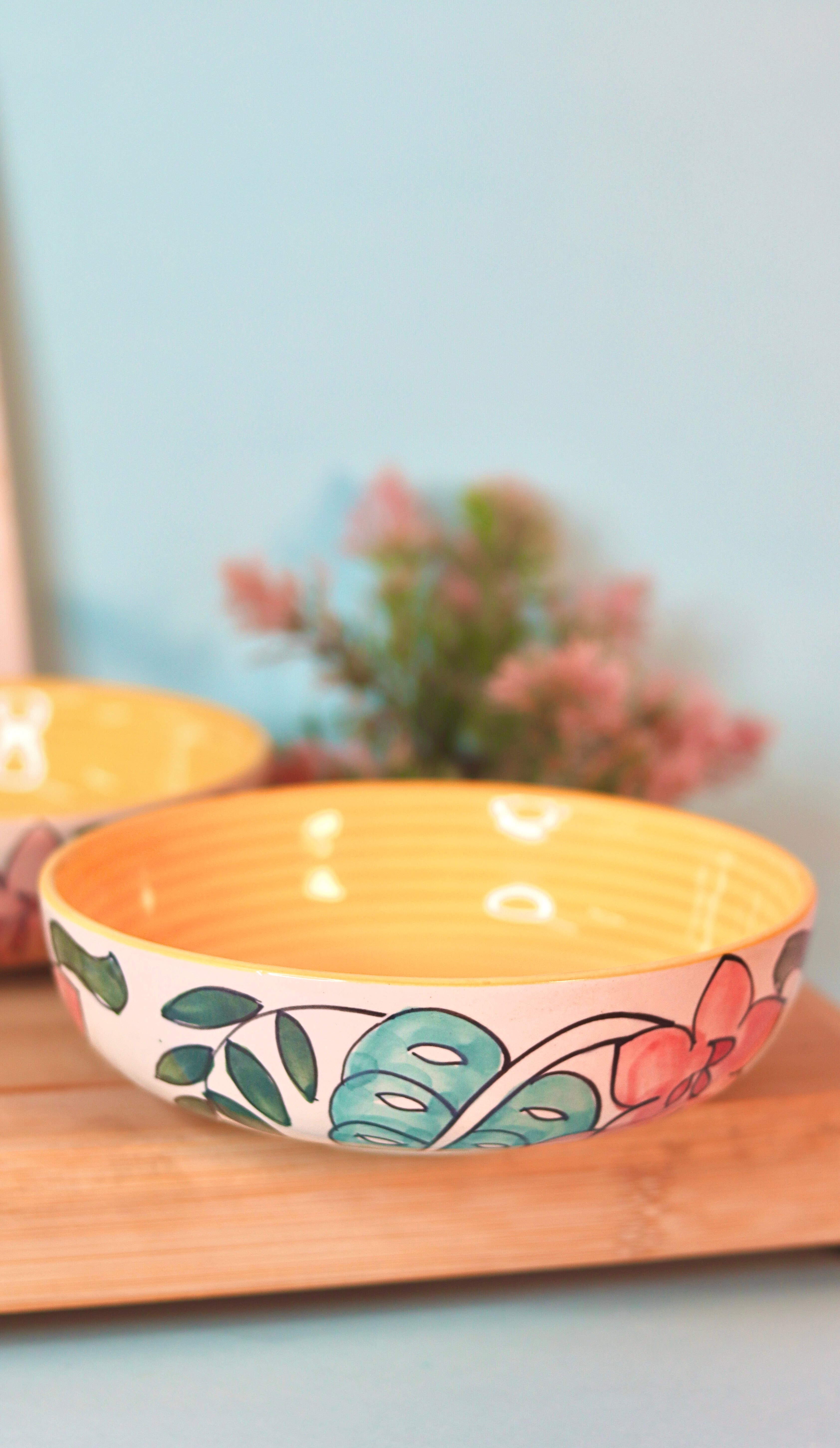Tropicana Bloom Bowl by KLAEORA – hand-painted ceramic bowl with floral and leaf design in orange and tropical tones