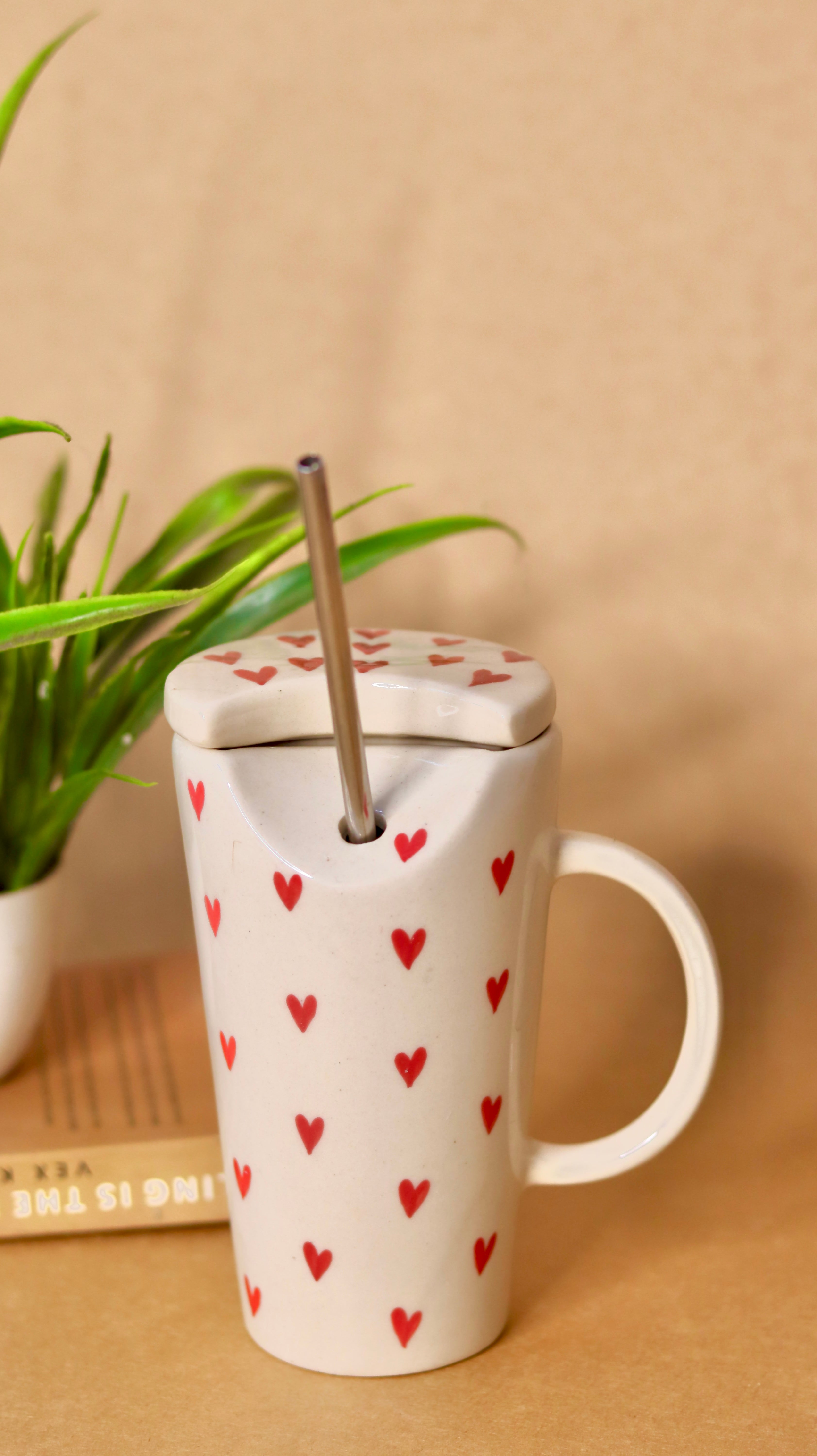 White ceramic sipper with red hearts 