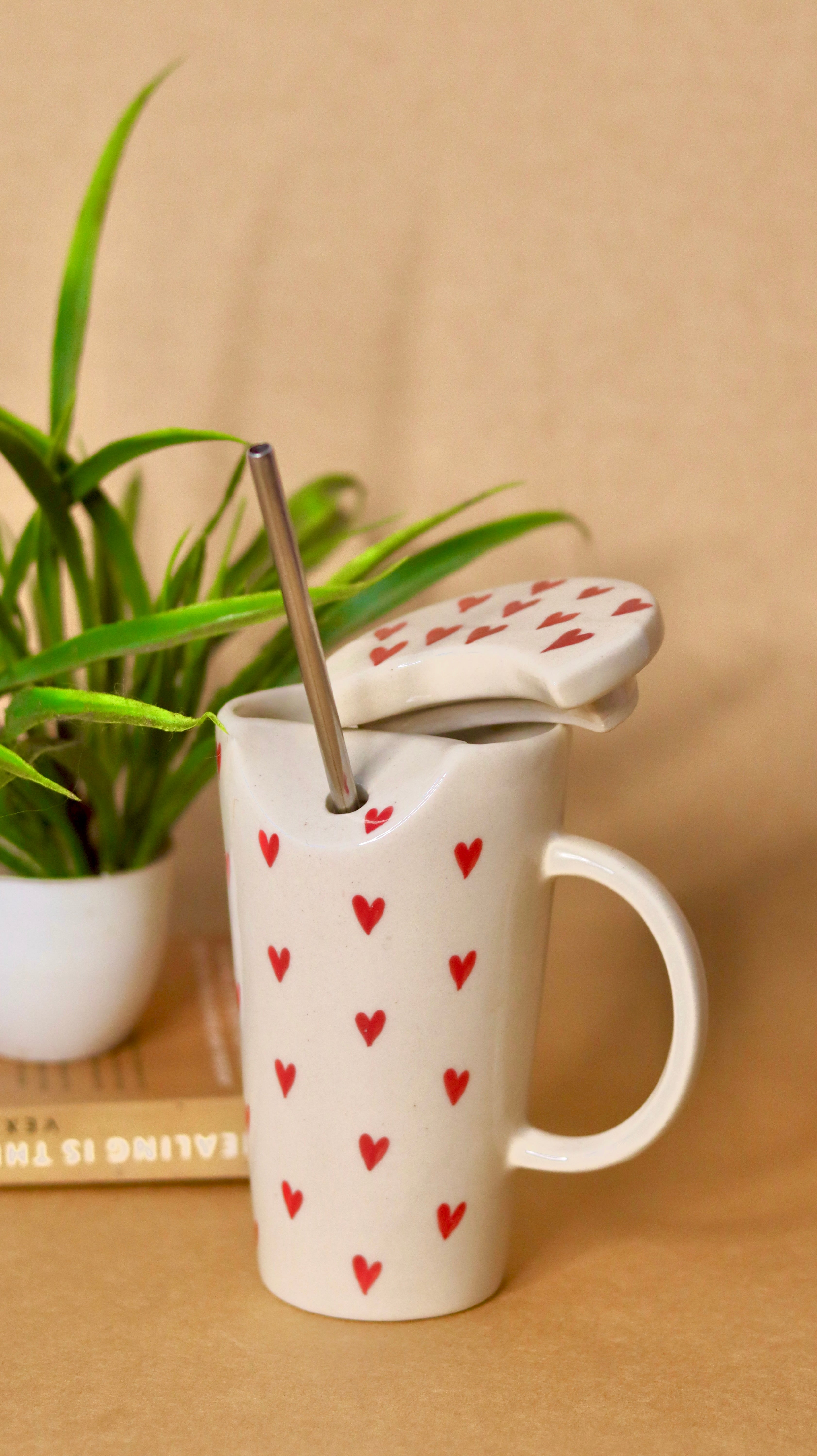 White ceramic sipper with red heart with straw 