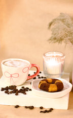 À La Bow ceramic cup and saucer set with delicate bow detail and soft blush finish by KLAEORA