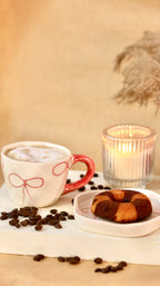 À La Bow ceramic cup and saucer set with delicate bow detail and soft blush finish by KLAEORA